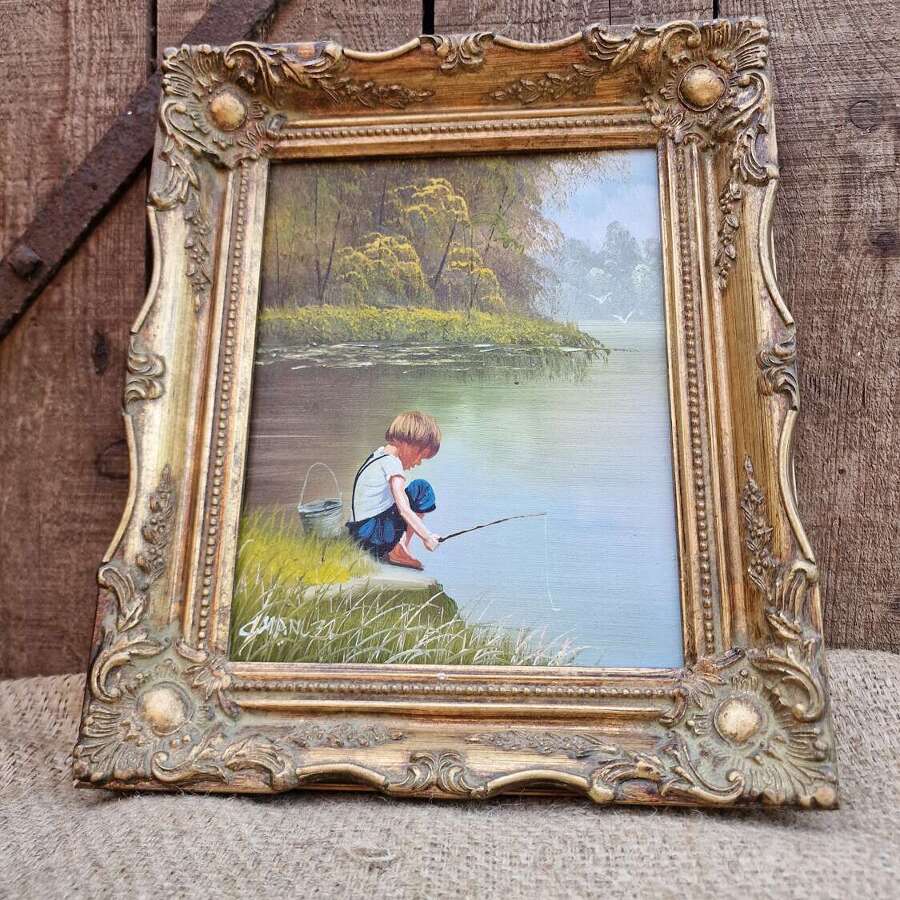 Boy fishing framed oil on canvas