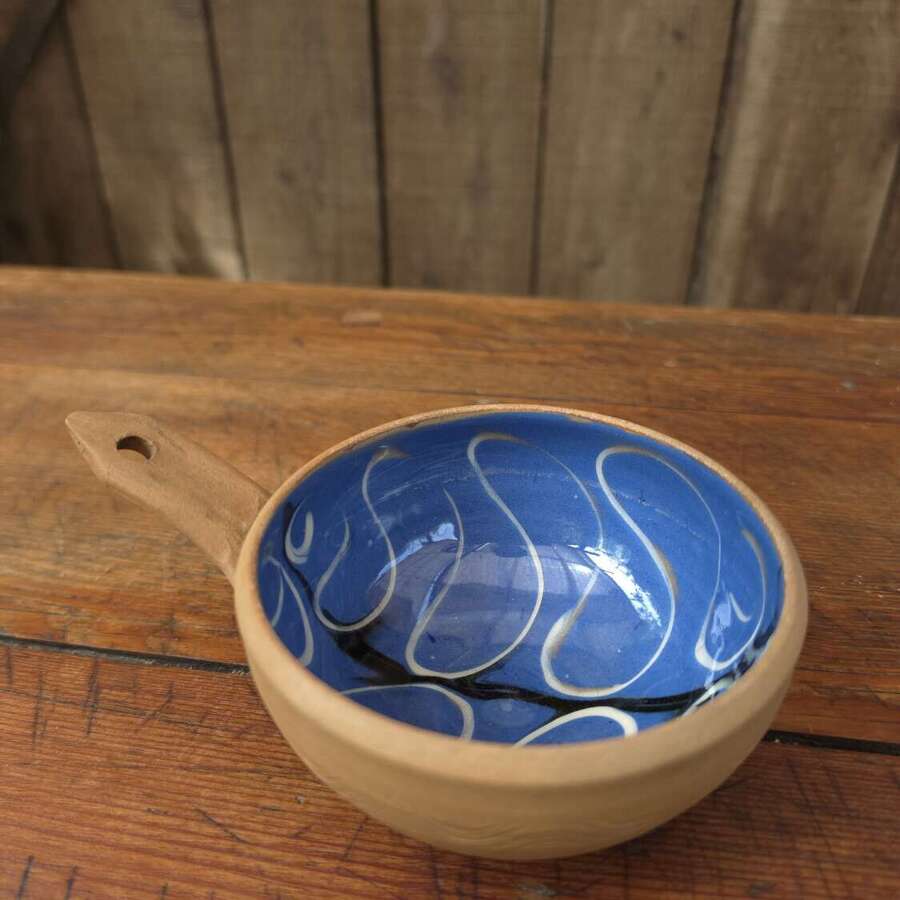 Handmade Cricklade pottery pouring bowl in rich blue glaze