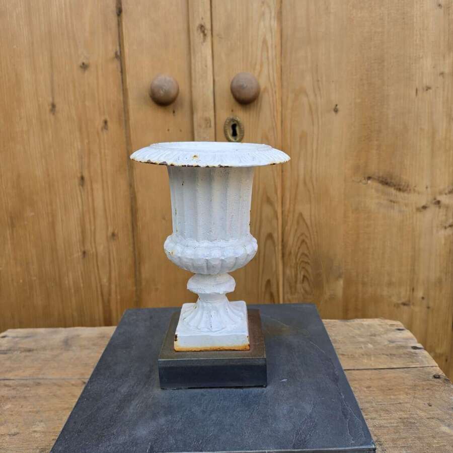 Vintage cast iron urn on slate base