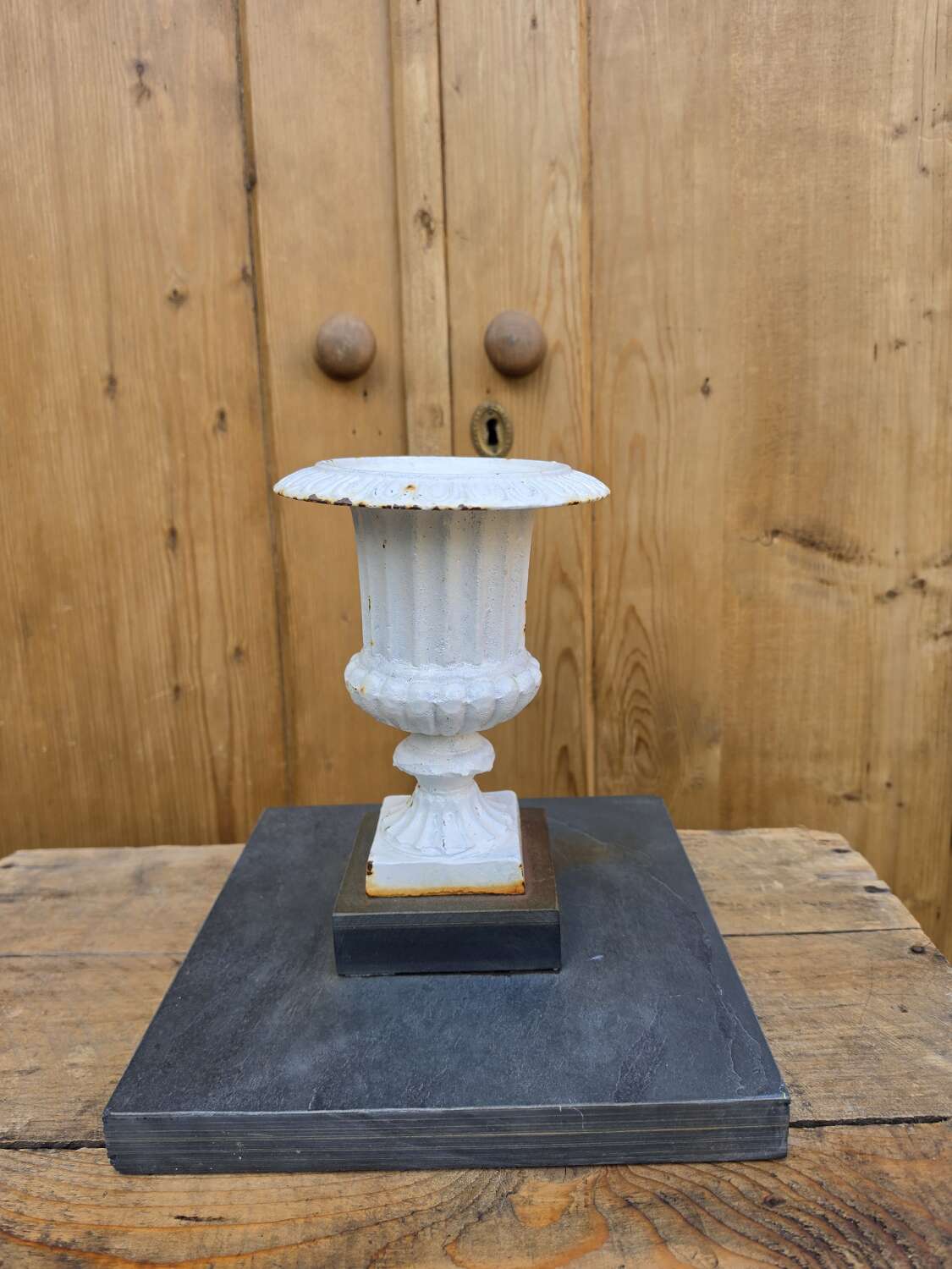 Vintage cast iron urn on slate base
