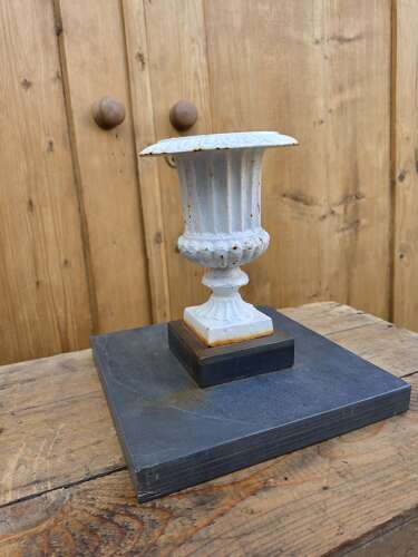 Vintage cast iron urn on slate base