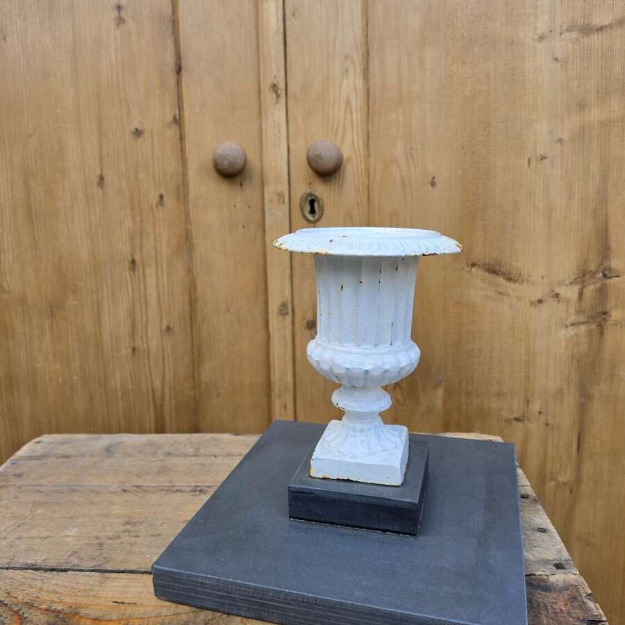 Vintage cast iron urn on slate base