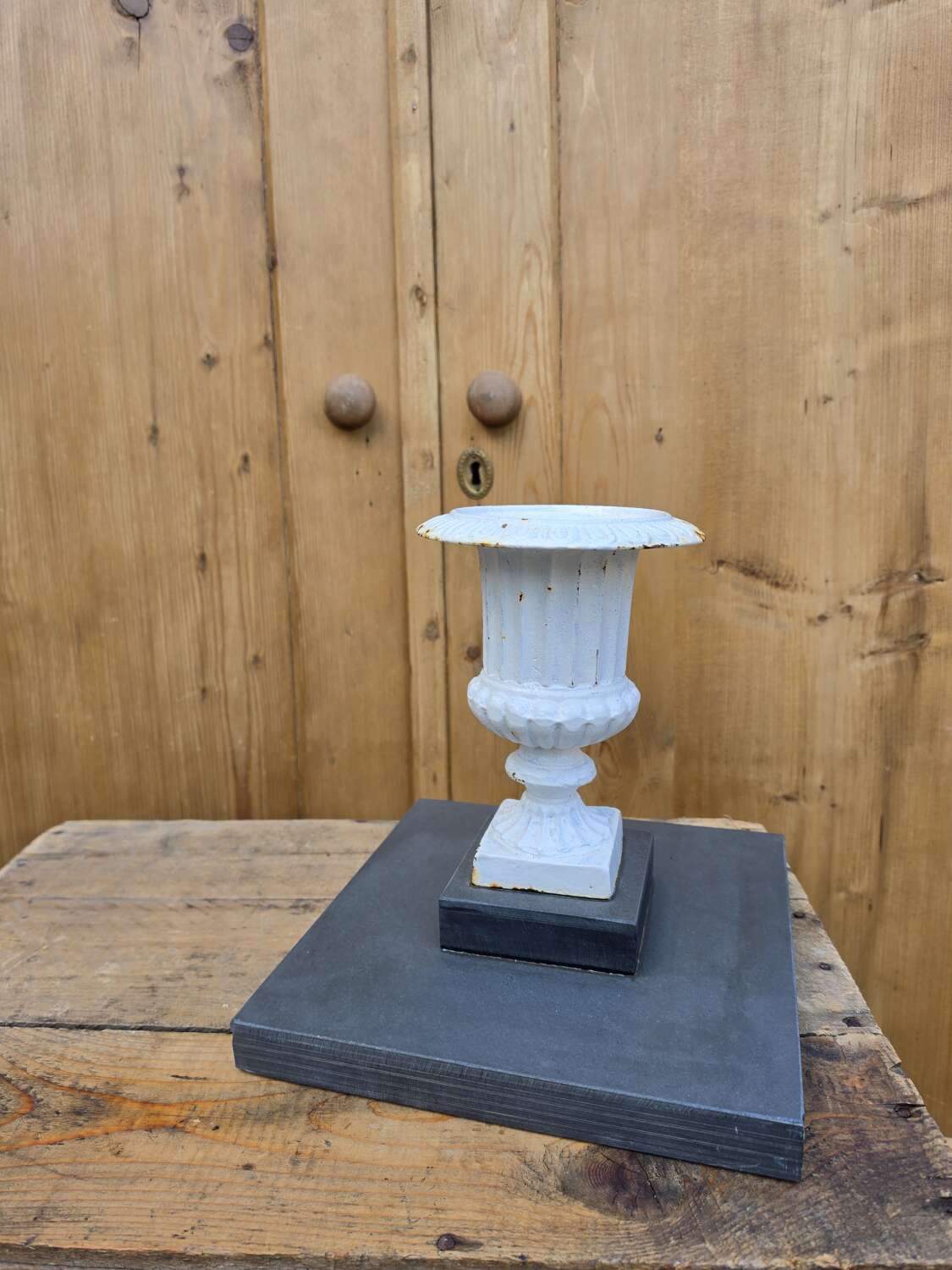 Vintage cast iron urn on slate base