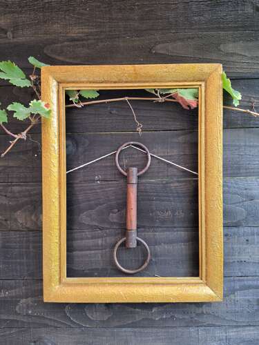 Antique horse bit with wooden centre